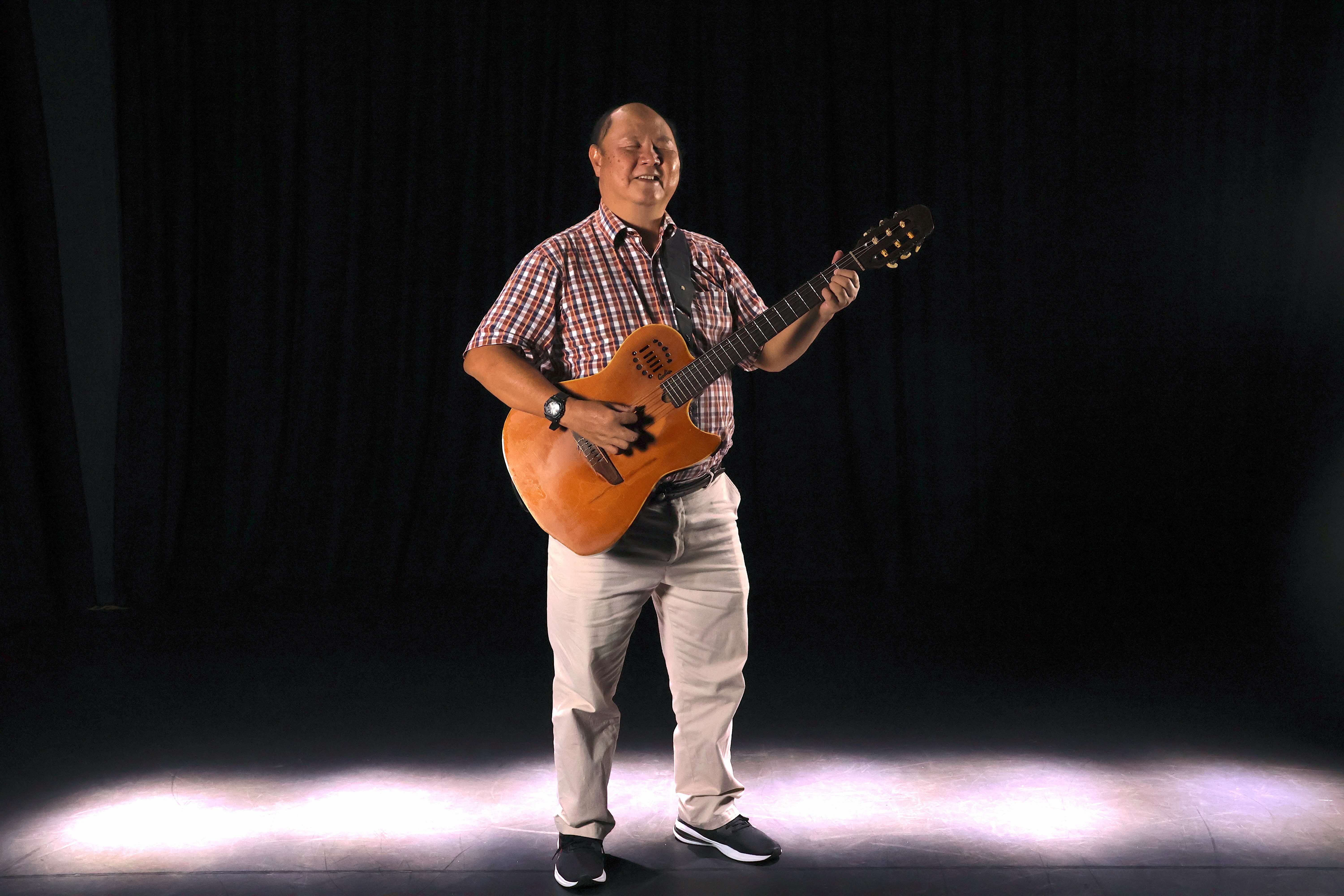 ART:DIS artiste Daniel Ng performing with a guitar